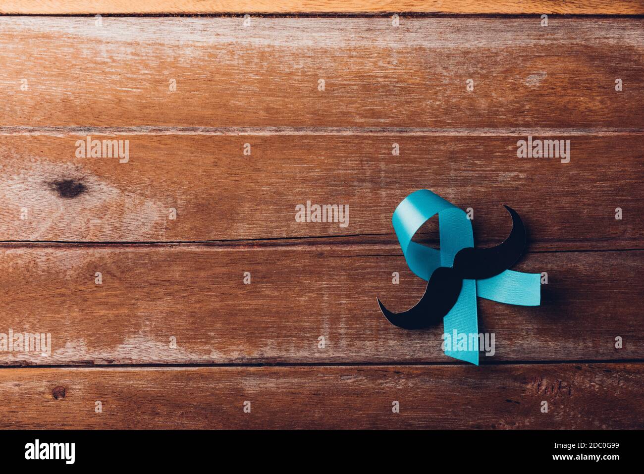 November Blue, Light blue ribbon with a man mustache on wooden ...