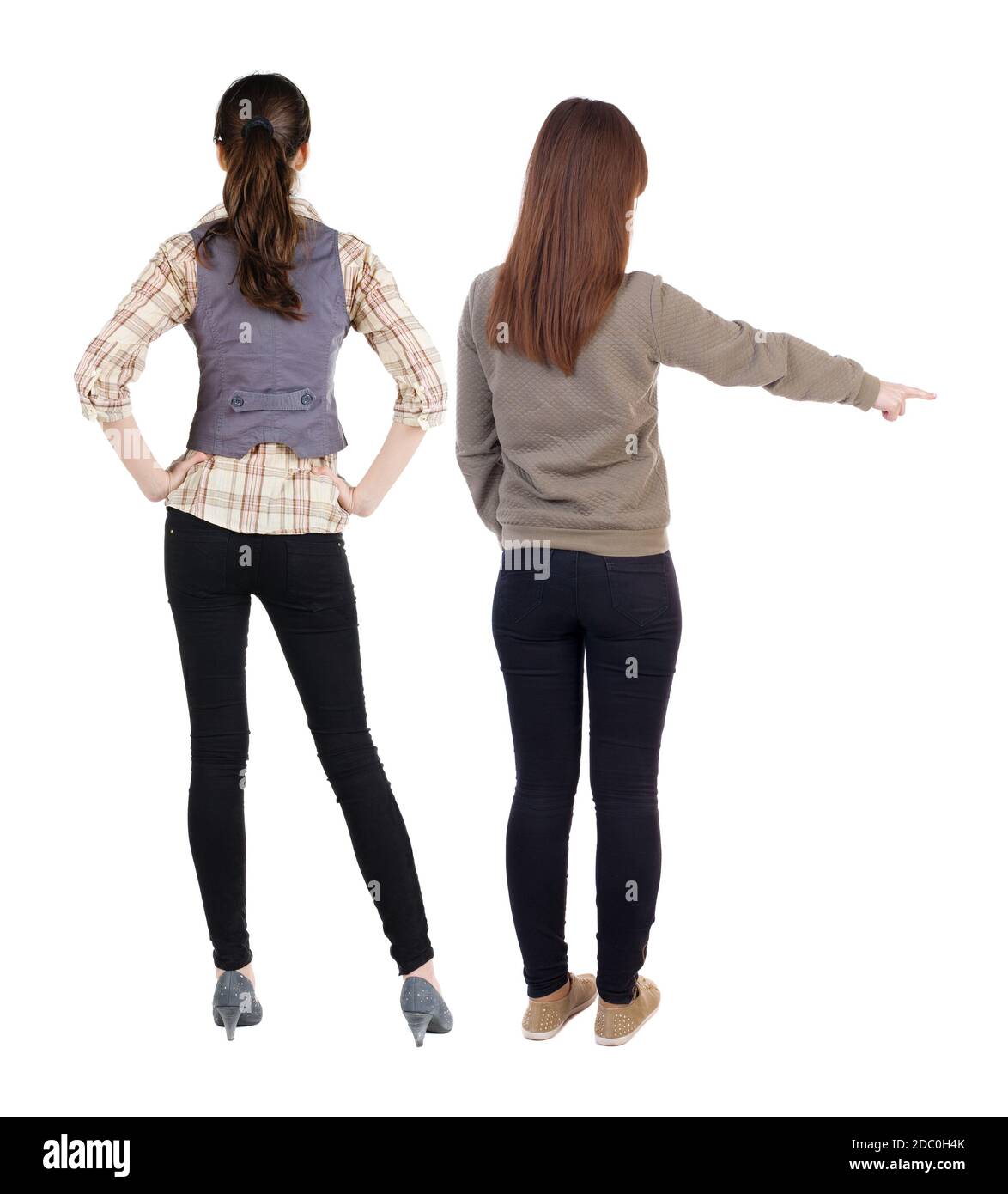 First Back View Back view of two young woman photographed on a mobile phone in sweater ...