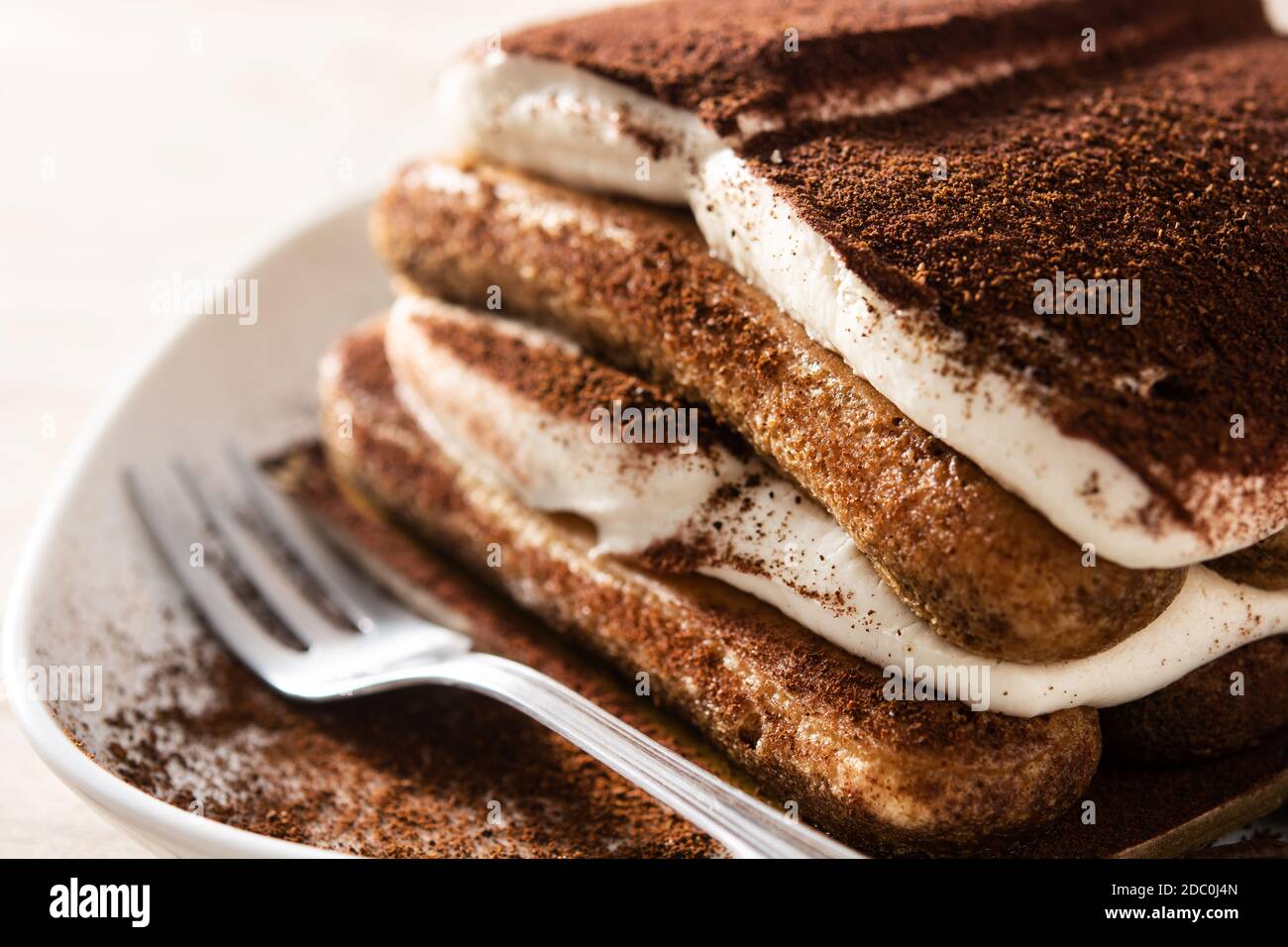 Traditional tiramisu cake on wooden table Stock Photo