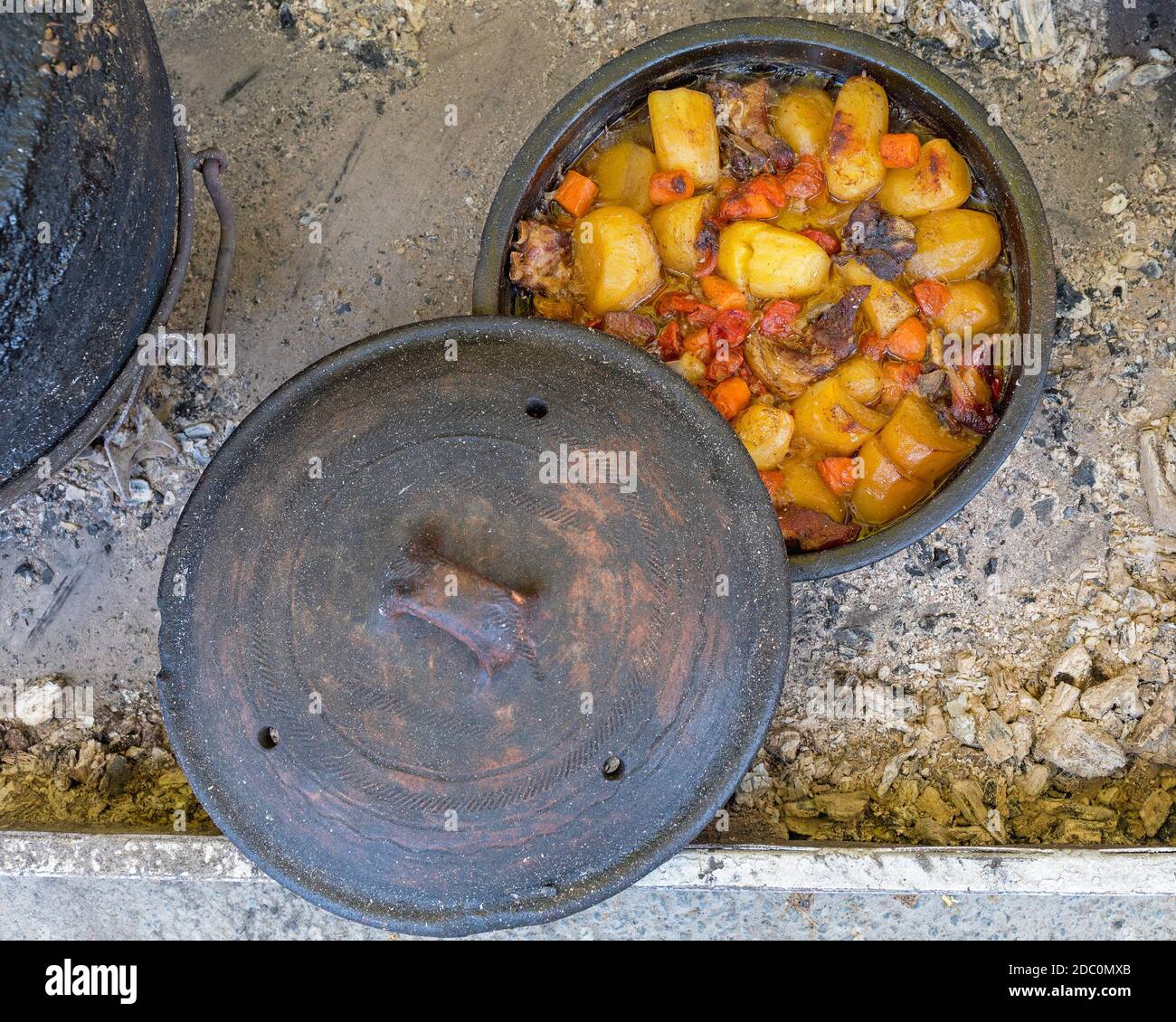 Slow Cooking in Cast Iron Pot at Coals Fire Stock Photo Alamy