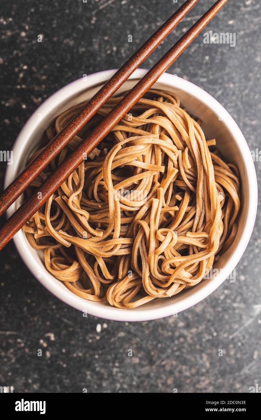 Cooked soba noodles. Traditional asian pasta in bowl. Top view Stock