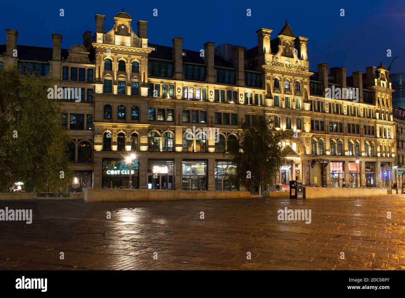 Corn Exchange building at twilight, Exchange Square, Manchester, UK. Empty streets during the November lockdown. Stock Photo