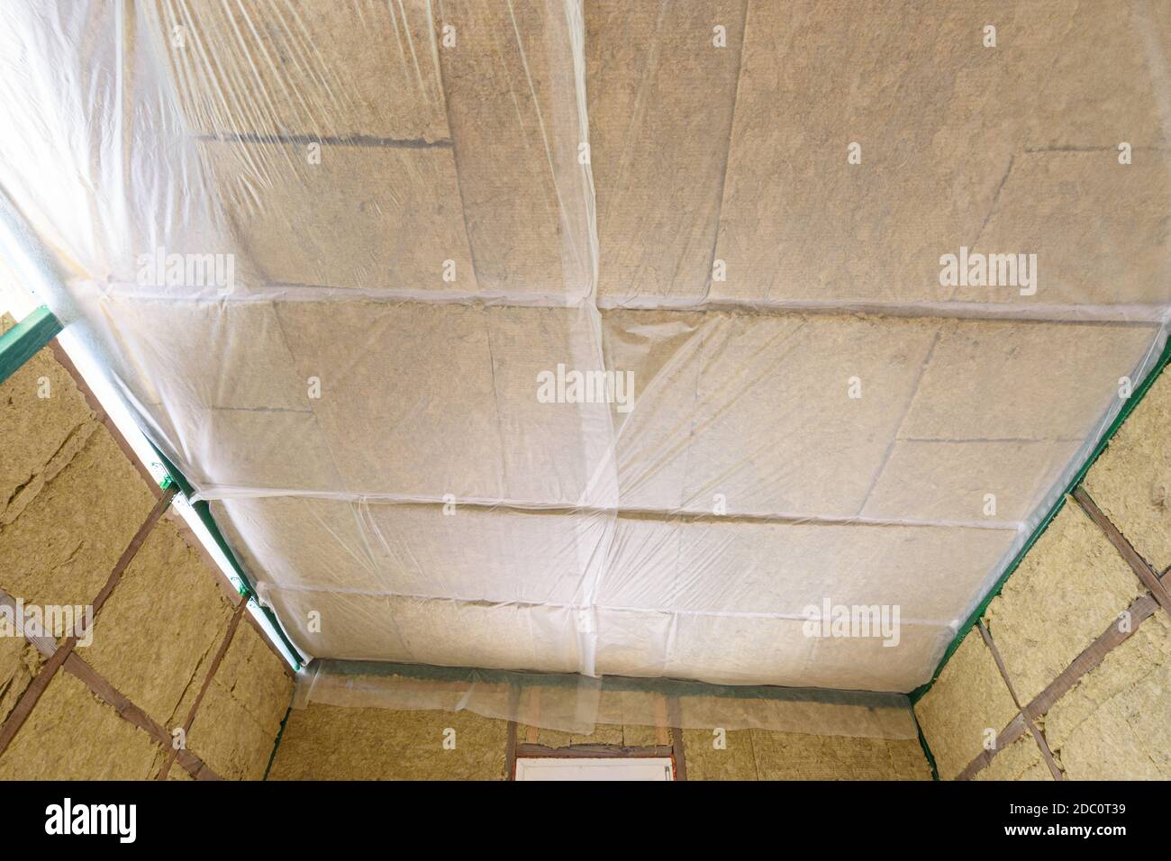 Insulated ceiling of a country house, insulation is closed with a vapor