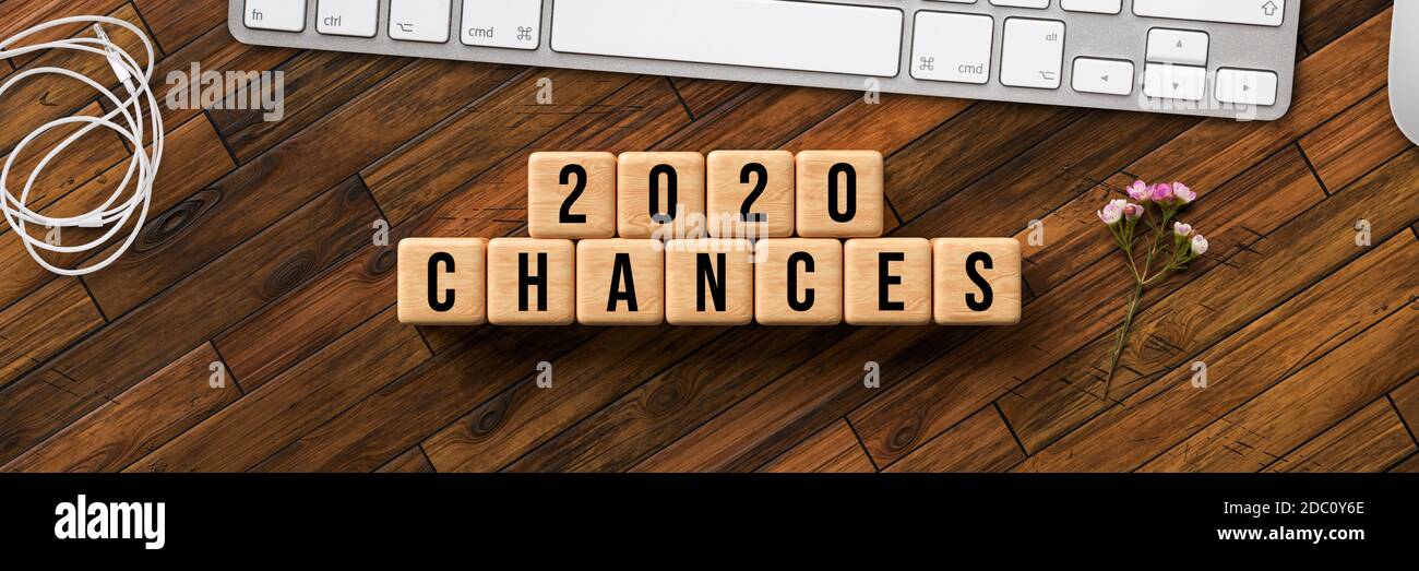 cubes with message 2020 CHANCES with computer keyboard on wooden background Stock Photo