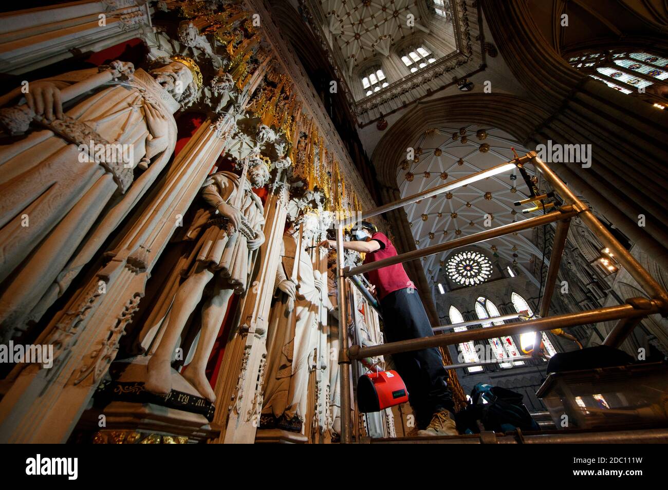 Lead Mason Conservator Lee Godfrey workers using museum grade vacuums
