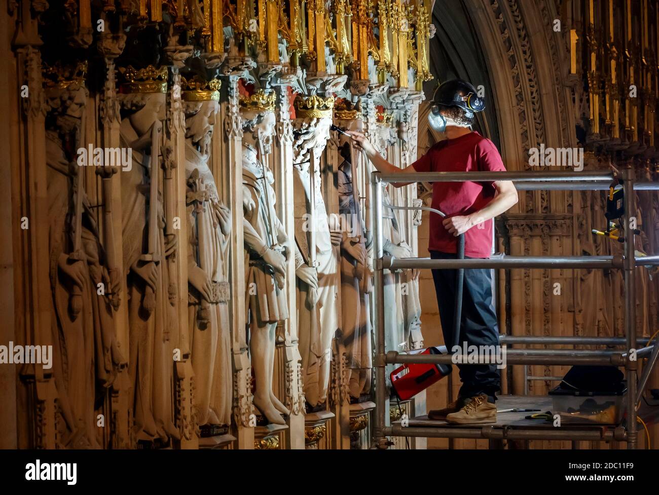 Lead Mason Conservator Lee Godfrey workers using museum grade vacuums