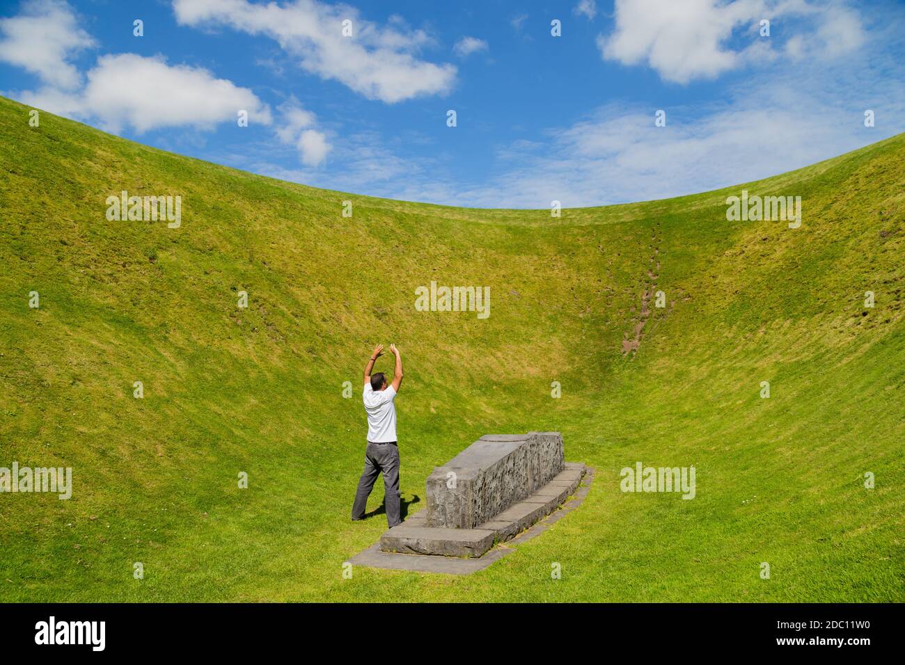 Man with open arms at the the Irish Sky Garden Crater, Skibbereen, West Cork.  Ireland Stock Photo - Alamy