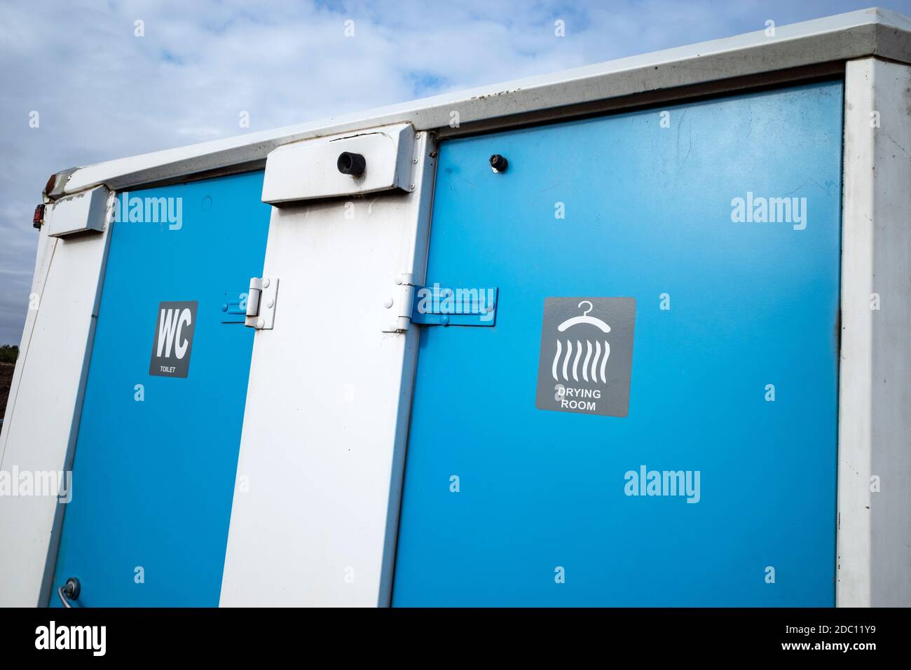Portable toilet and drying room on construction site Stock Photo