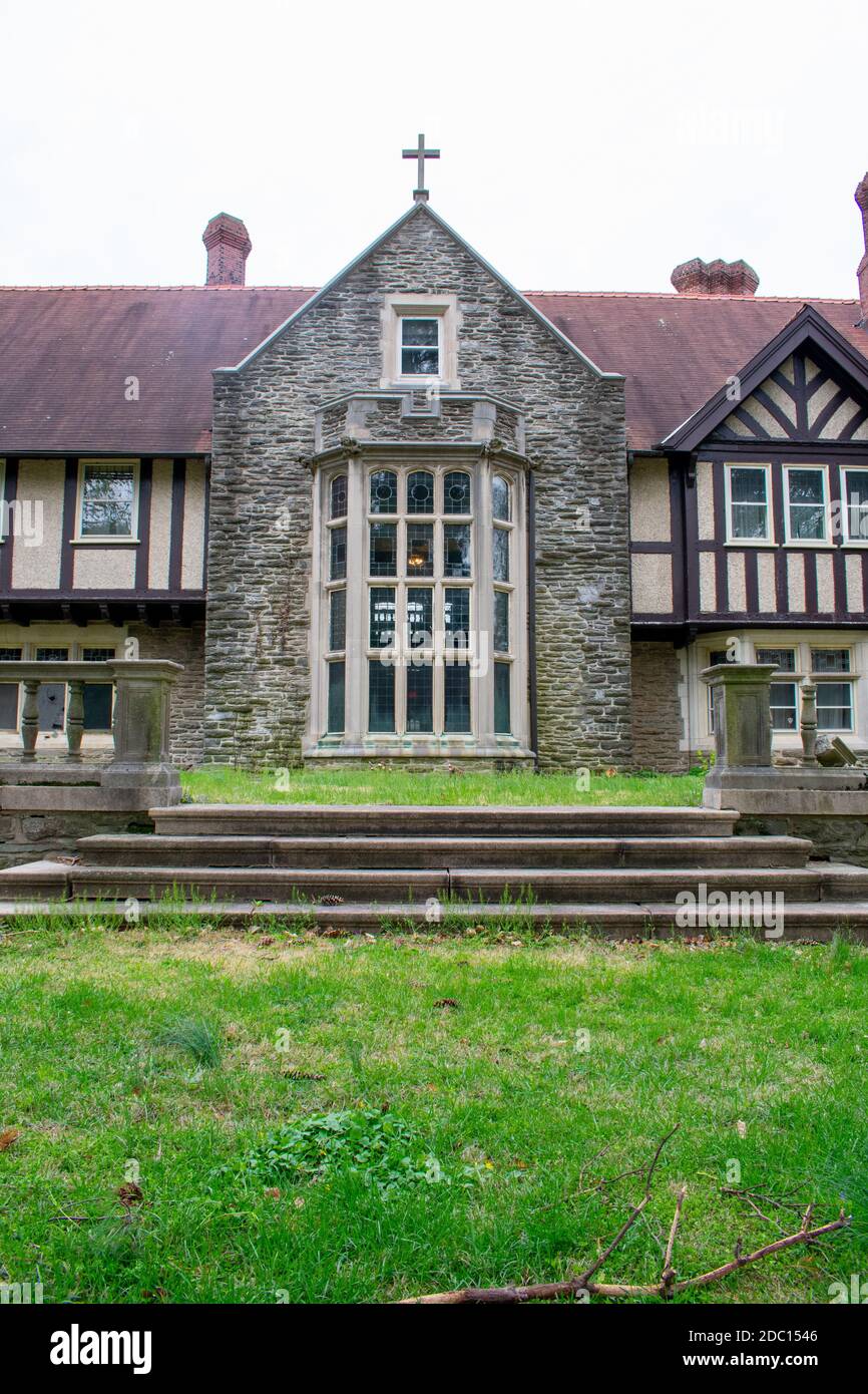 A Detailed and Ornamental Cobblestone Building With a Red Roof Stock ...