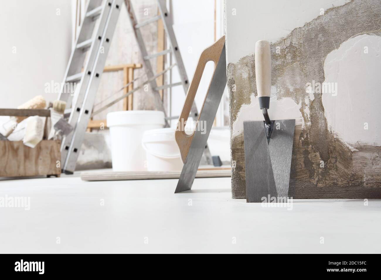 Indoor shot close up frontal view of bricklayer, plasterer or house ...