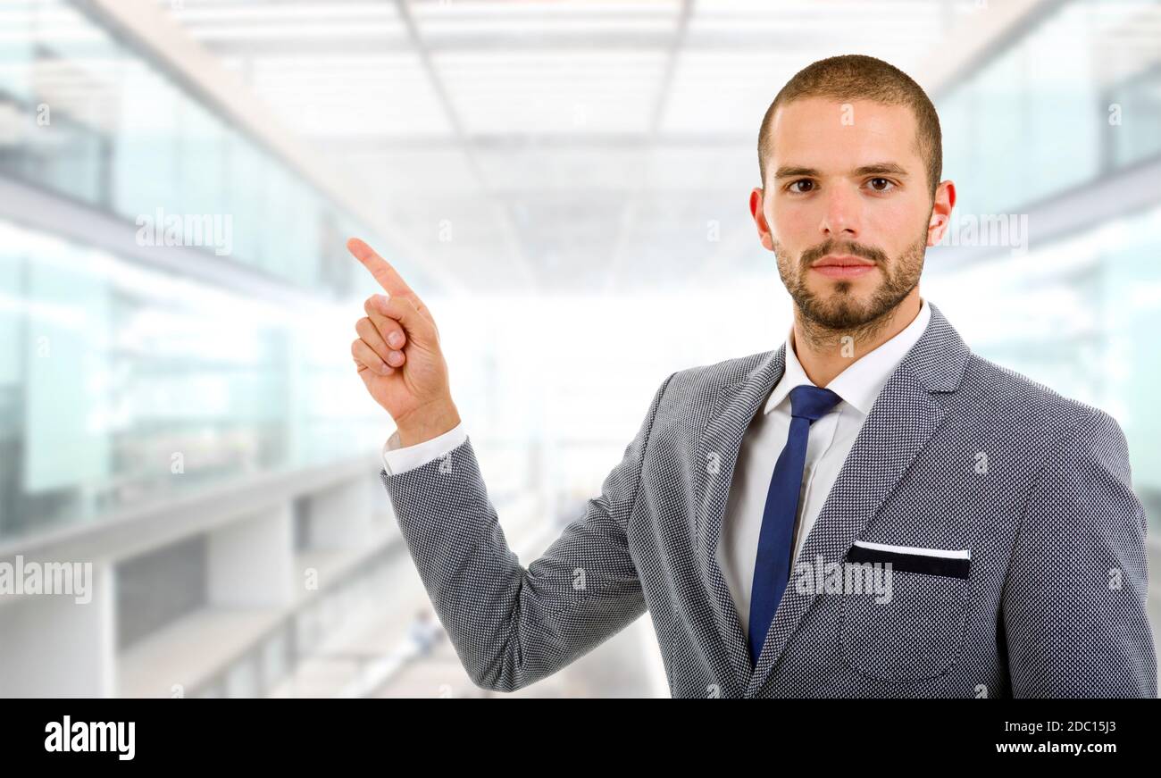 business man in a suit pointing with his finger, at the office Stock ...