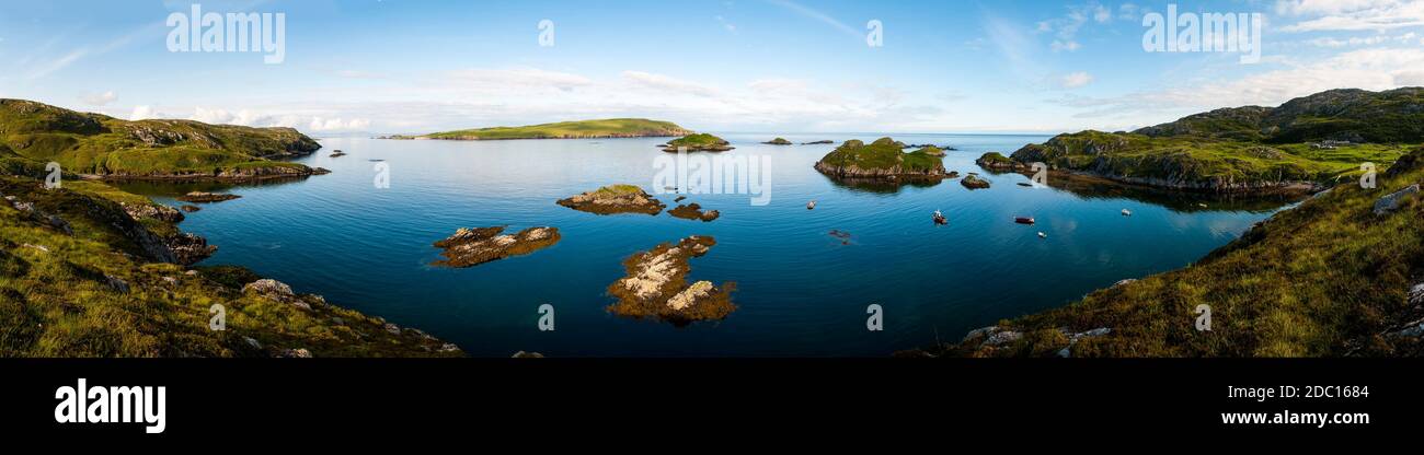 A panoramic view across Tarbet Bay and the Sound of Handa to the islands of (left to right) Handa, Eilean an Aigeich, Eilean Ard and Eilean Dubh (with Stock Photo