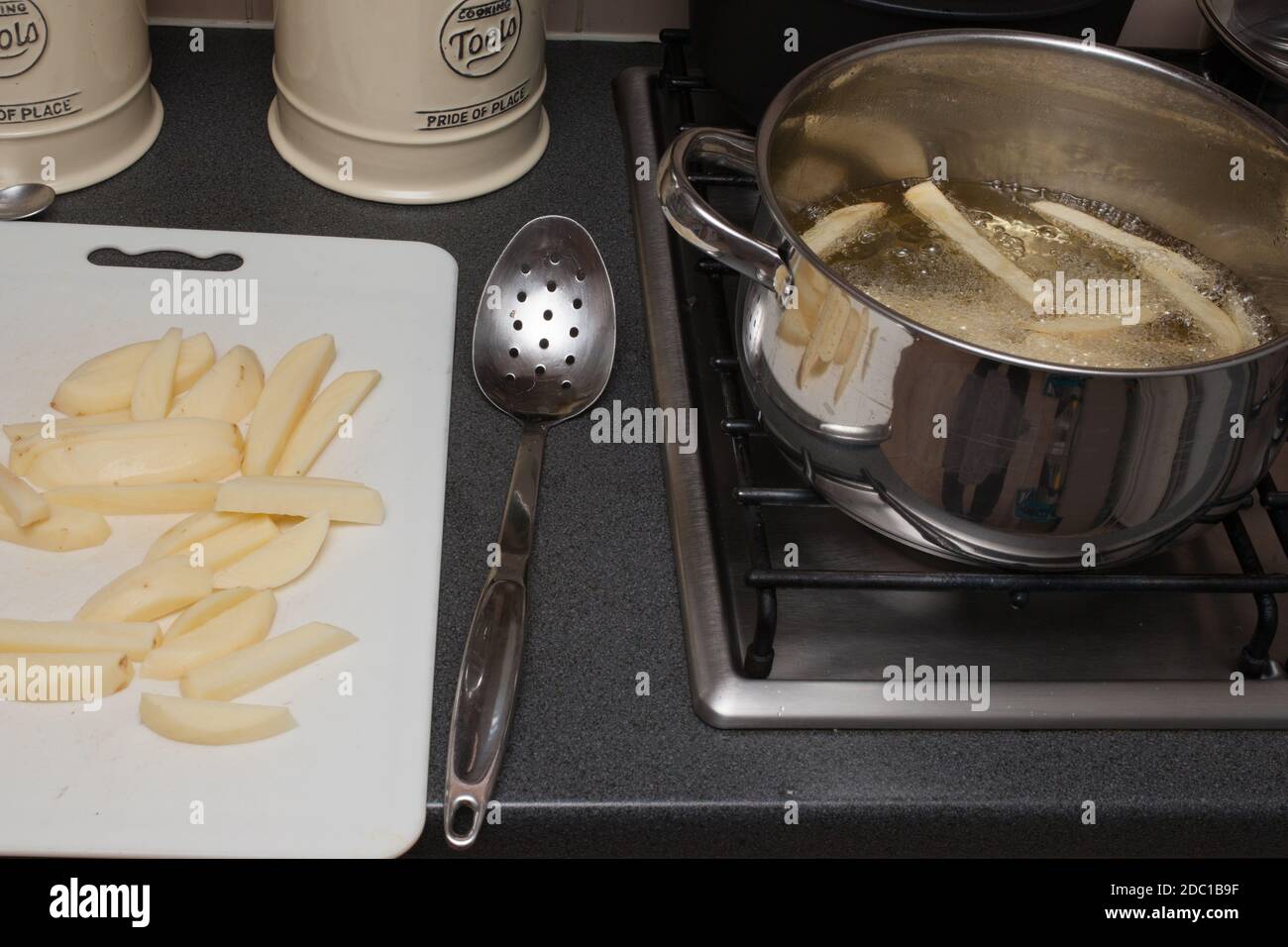 The process of making homemade British potato chips Stock Photo Alamy
