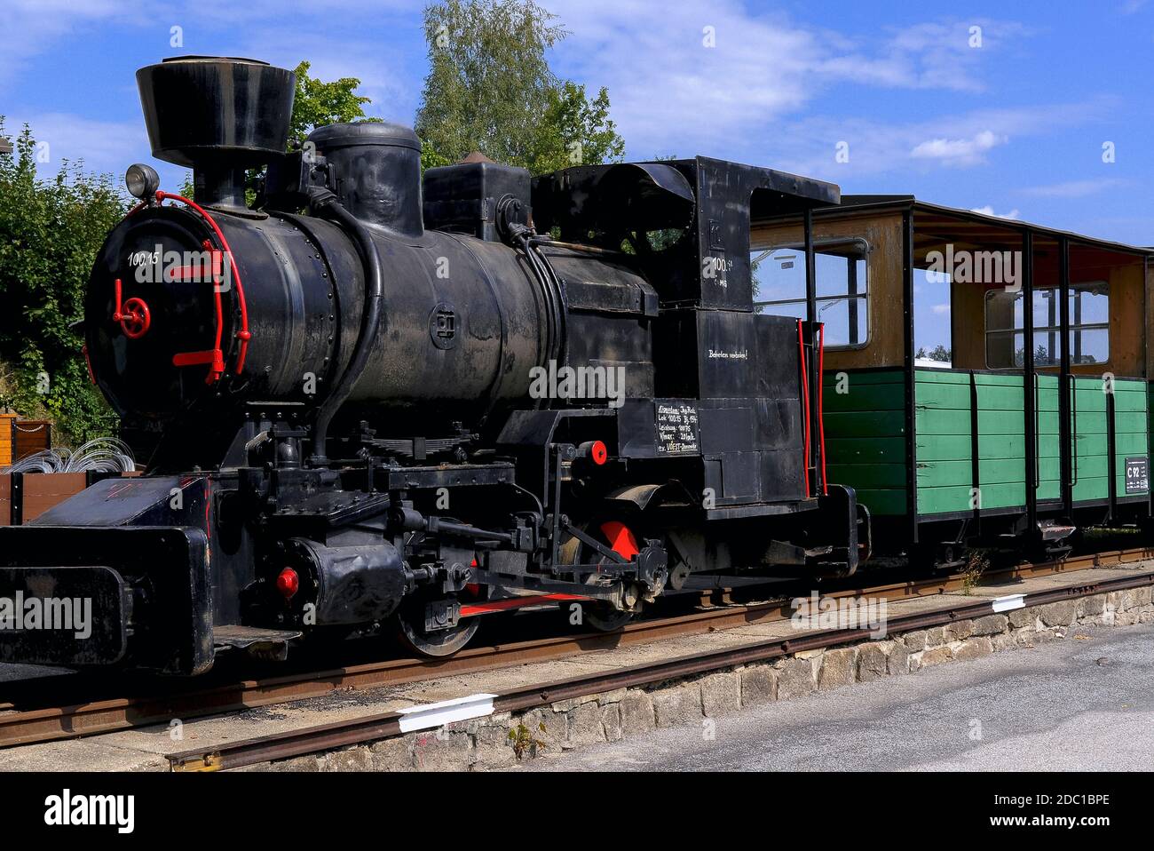 Narrow gauge (790 mm) steam locomotive ÖAM 100.15, built in 1947 and originally used in mining and metals production, pictured in 2008 with two open carriages at Heidenreichstein, Gmünd, Lower Austria.   The locomotive was moved in 2014 from this location, the former north east terminus of the Waldviertelbahn or Waldviertler Schmalspurbahn, to a new home at Milovice in the Czech Republic.  The Waldviertelbahn is a former industrial 760 mm narrow gauge network today preserved and run as a heritage attraction. Stock Photo
