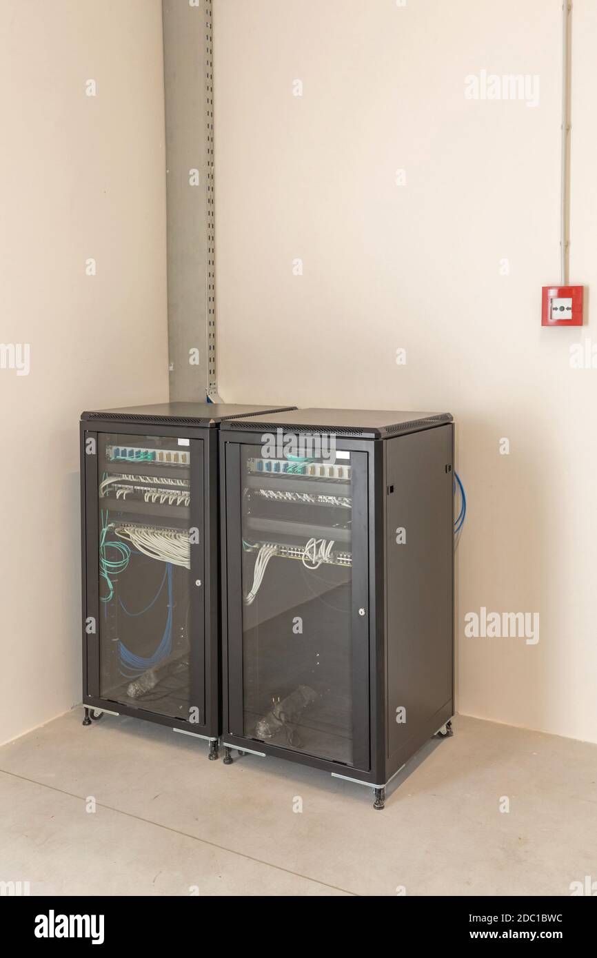 Two Server Racks Enclosures and Network Cabinets in Room Stock Photo ...