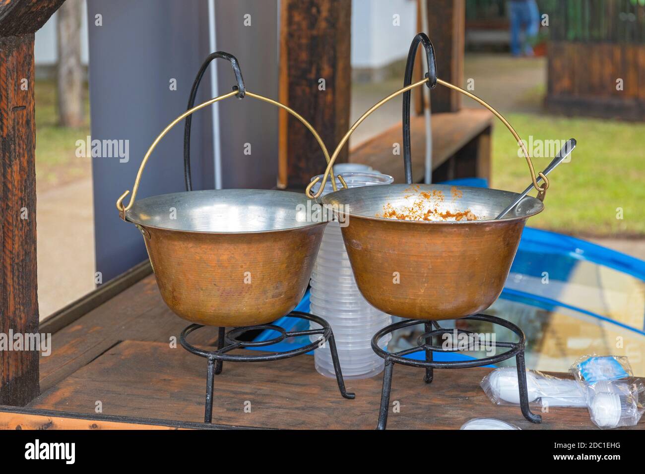 https://c8.alamy.com/comp/2DC1EHG/two-cast-iron-cauldrons-at-stand-in-kitchen-2DC1EHG.jpg