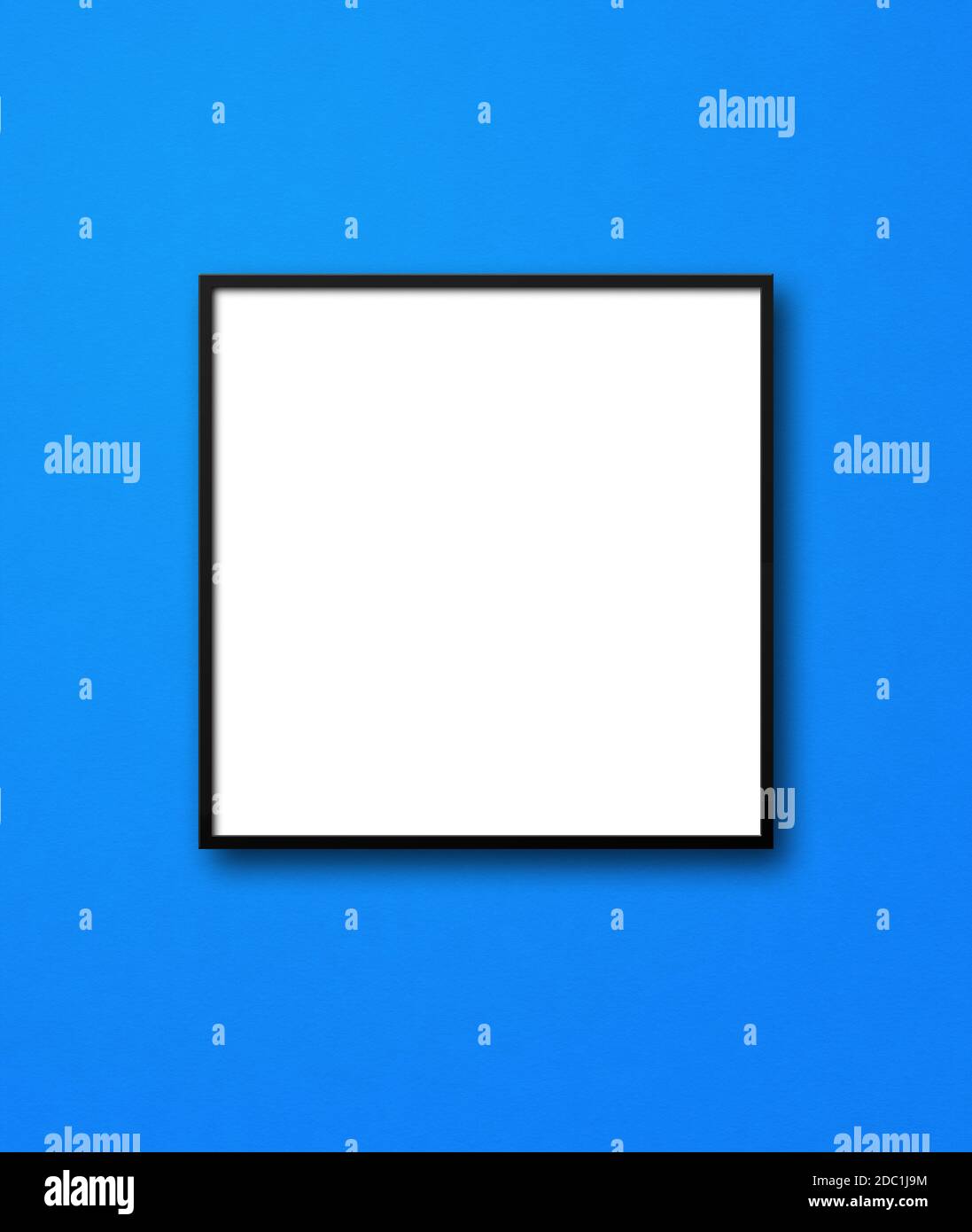 Black square picture frame hanging on a blue wall. Blank mockup ...