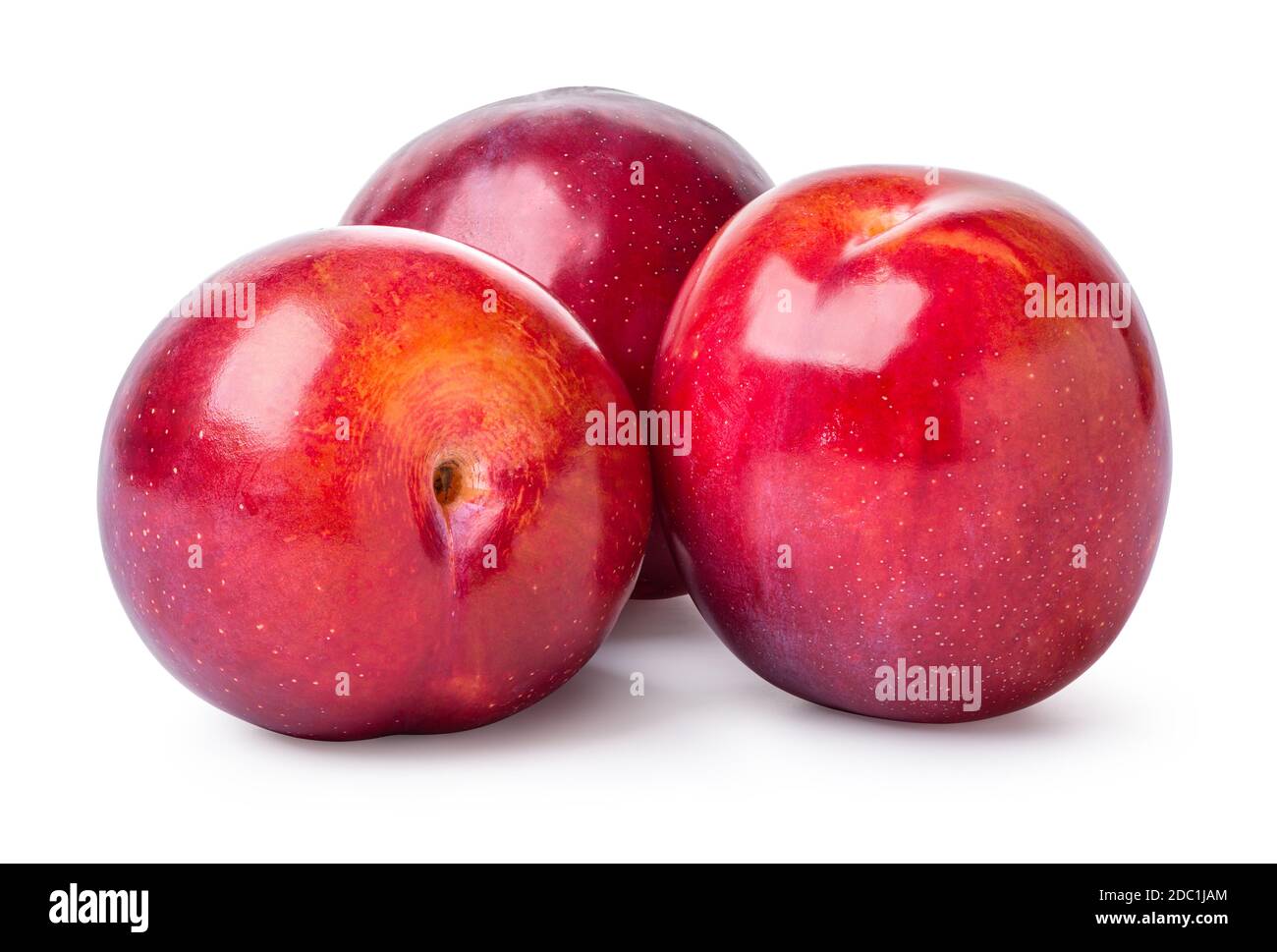 Three fresh sweet plums isolated on a white background Stock Photo