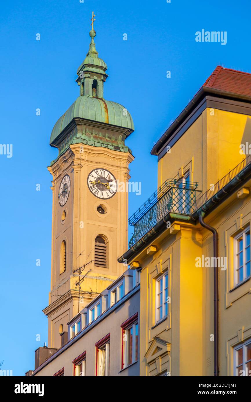 View of Heiliggeistkirche clock tower, Munich, Bavaria, Germany, Europe Stock Photo