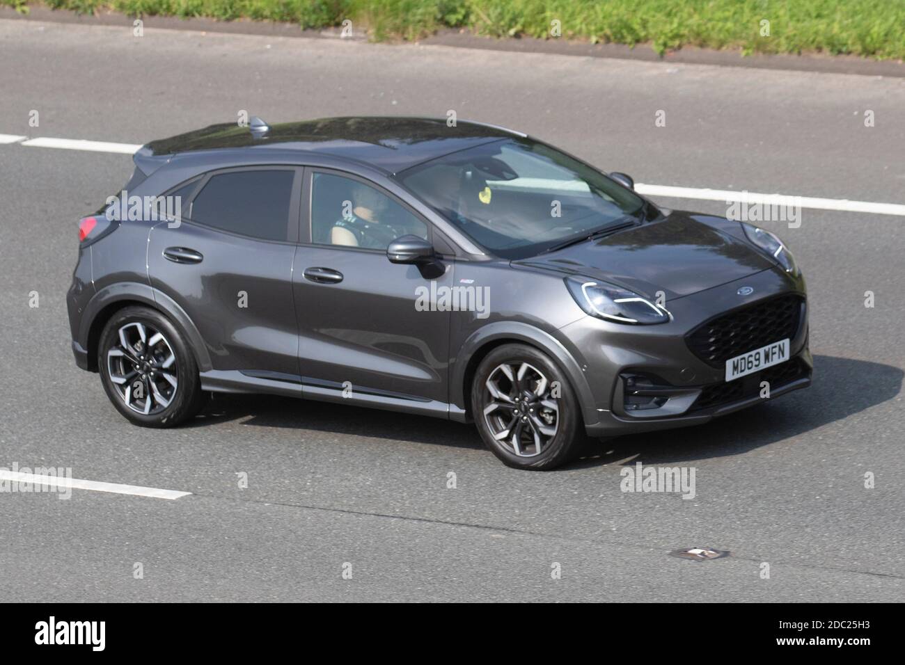 2020 grey Ford Puma St Line X First ED M Vehicular traffic moving vehicles cars vehicle driving on UK roads motors motoring on the M6 motorway highway UK road network Stock Photo