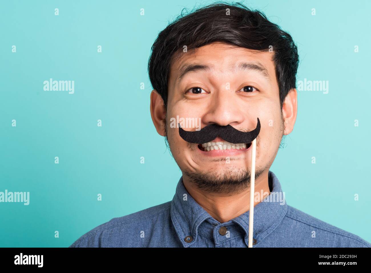 Young man with handlebar moustache hires stock photography and images