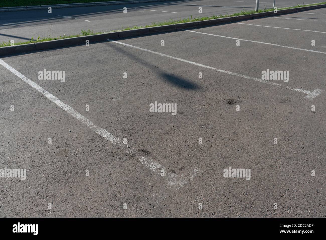 White markings of parking spaces on asphalt. Stock Photo