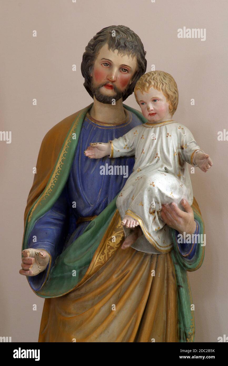 Saint Joseph holding baby Jesus Stock Photo Alamy
