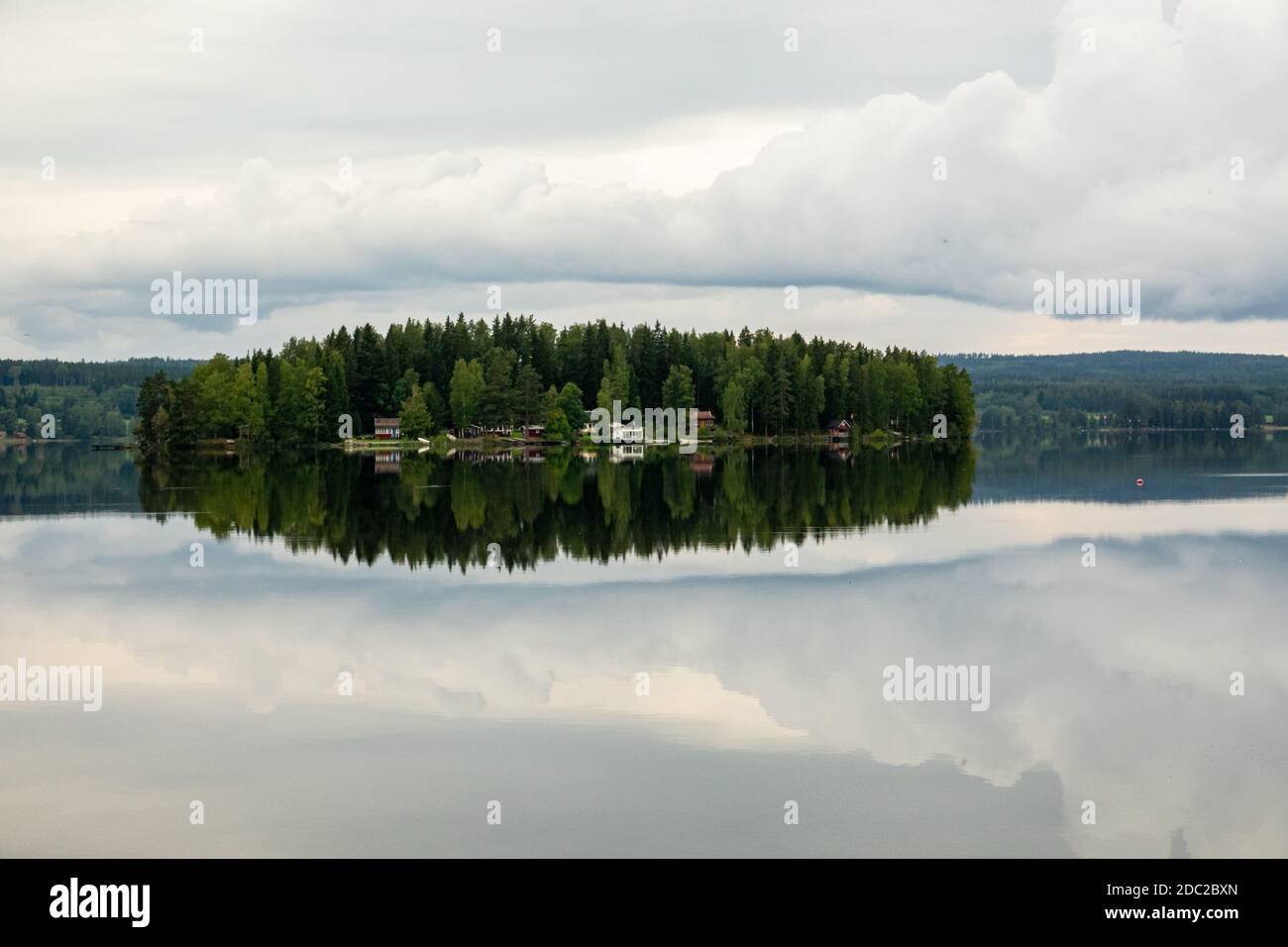 Misty morning at a lake during sunrise Stock Photo - Alamy