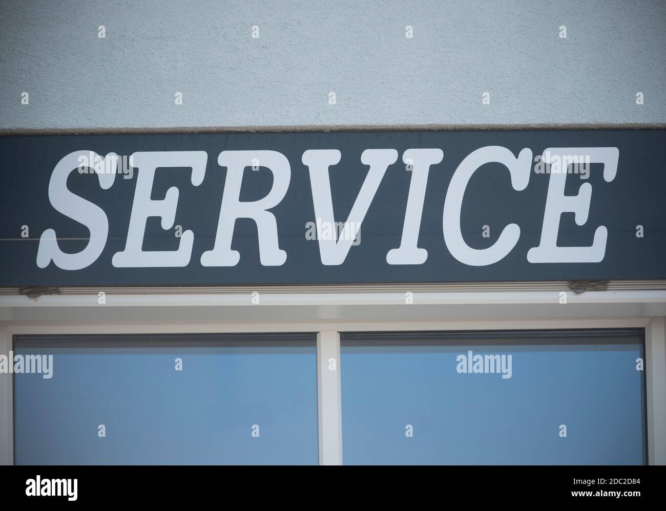 service sign on a wall, public service office in administration Stock Photo