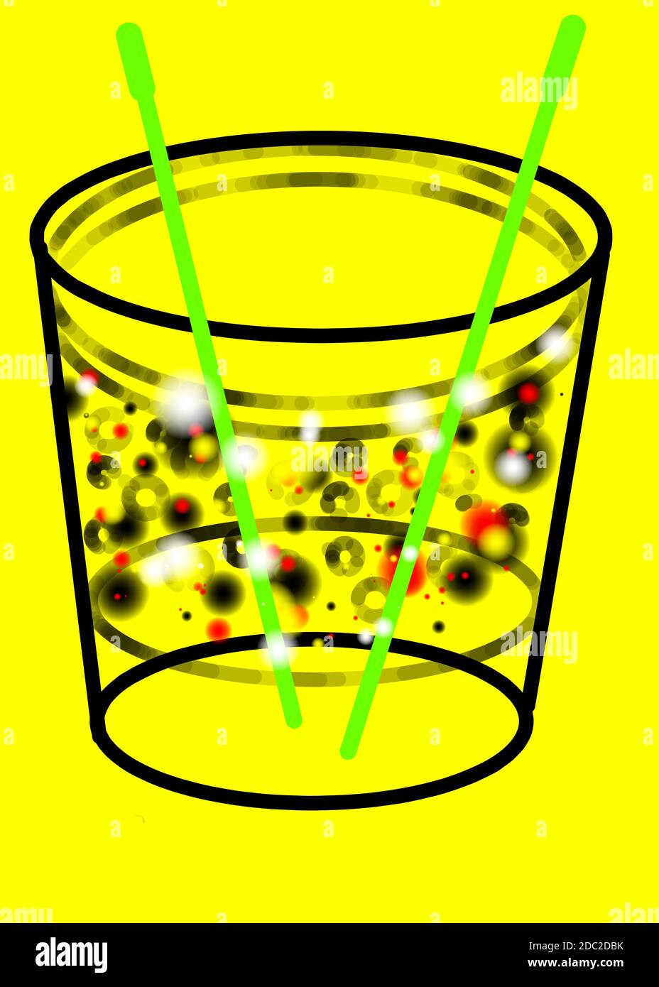 green straws in a glass on a yellow background Stock Photo