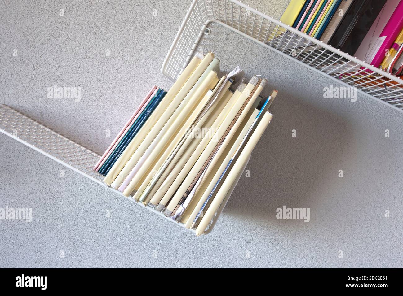 Modern iron rack bookshelf hanging on the wall with school books modern