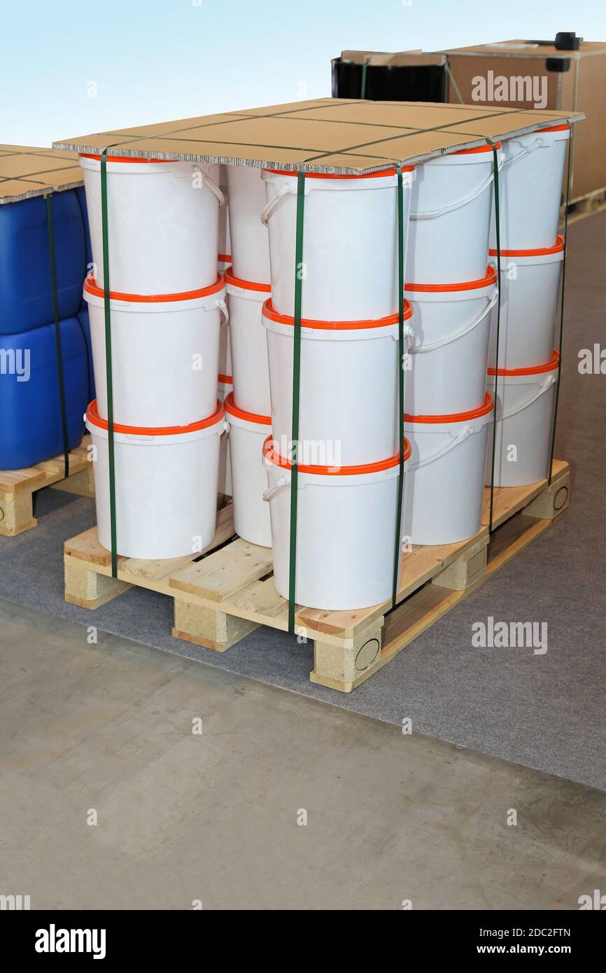 Packed cargo pallet with white plastic buckets Stock Photo Alamy