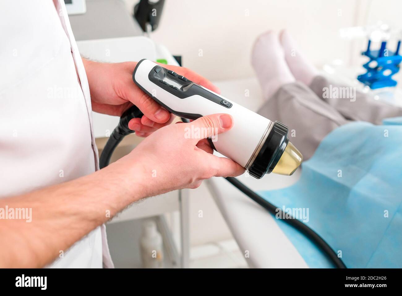 A nurse holds a medical device in her hands. Urologist Stock Photo - Alamy