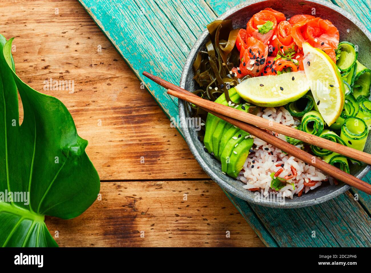 Hawaiian salmon poke bowl with rice,seaweed and avocado Stock Photo Alamy