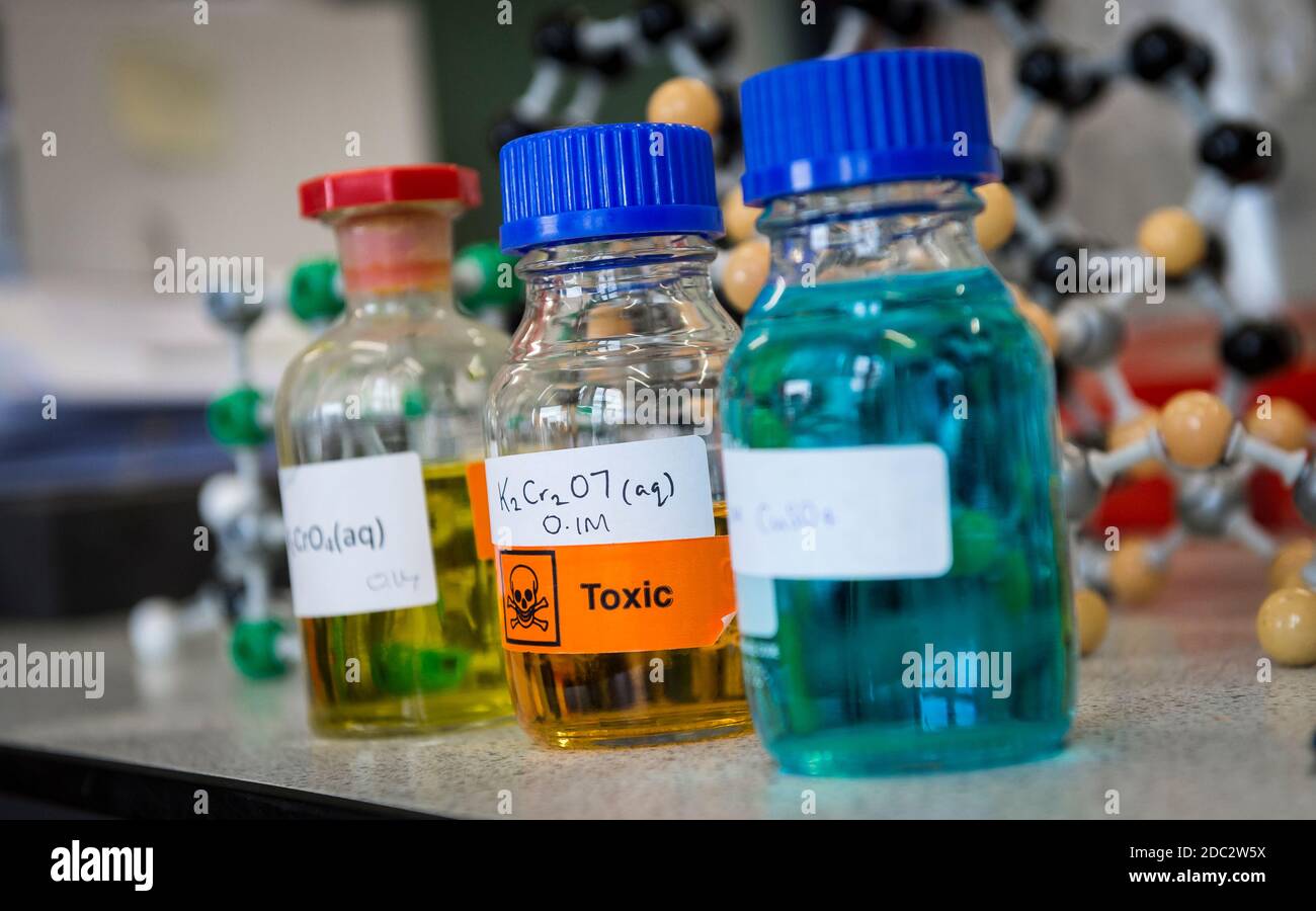 Bottles in a science laboratory in a college in England, UK. Stock Photo