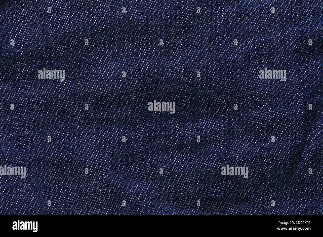 Background from dark blue jeans close up Stock Photo