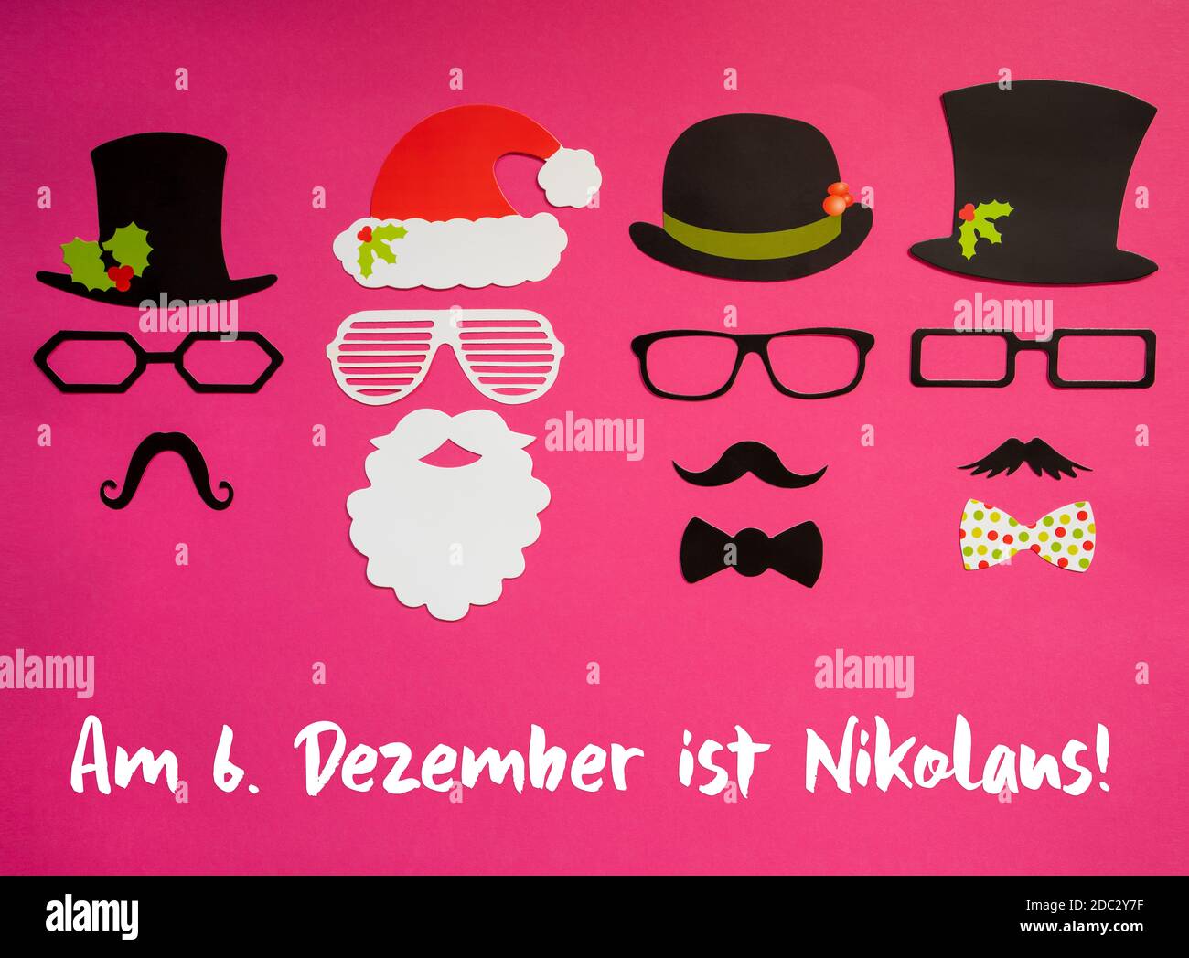 German Text Am Sechsten Dezember Ist Nikolaus Means Nicholas Day Is At December 6th. Santa Claus Mask And Three Cartoon Mask With Hat, Glasses And Bow Stock Photo