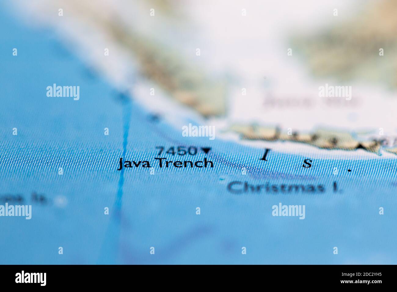 Shallow depth of field focus on geographical map location of Java Trench off coast of Indonesia Indian Ocean on atlas Stock Photo