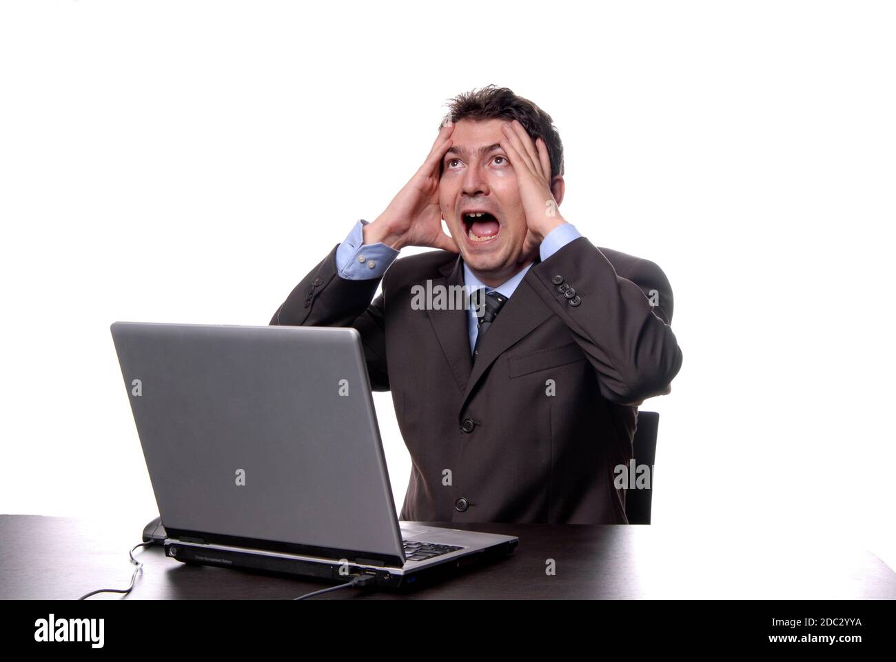 young crazy man working with is laptop Stock Photo