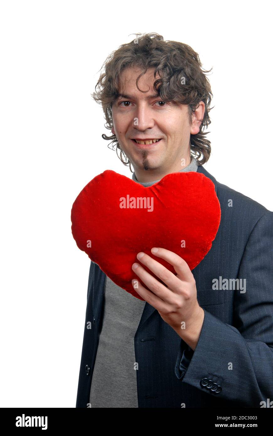man holding a red heart in the hand. On white background Stock Photo ...