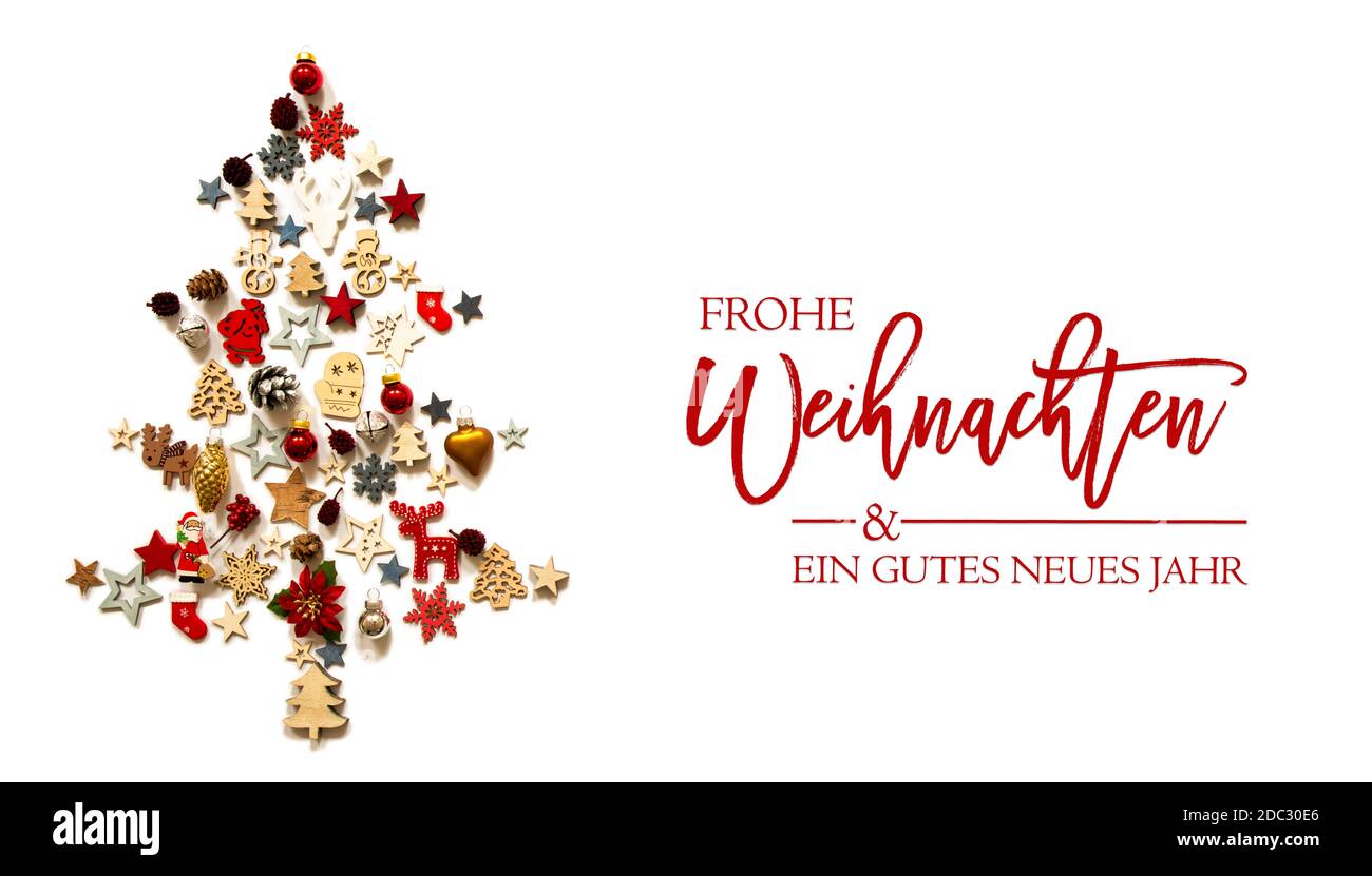 Christmas Tree Build Of Vairous Christmas Decoration And Ornaments. German Text Frohe Weihnachten Und Ein Gutes Neues Jahr Means Merry Christmas And A Stock Photo