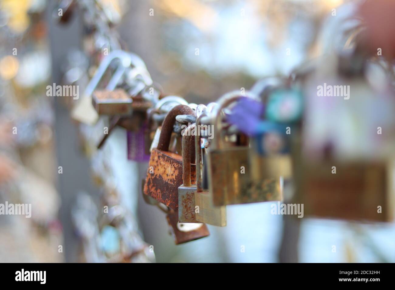 Closeup view on colorful padlocks on chain Stock Photo
