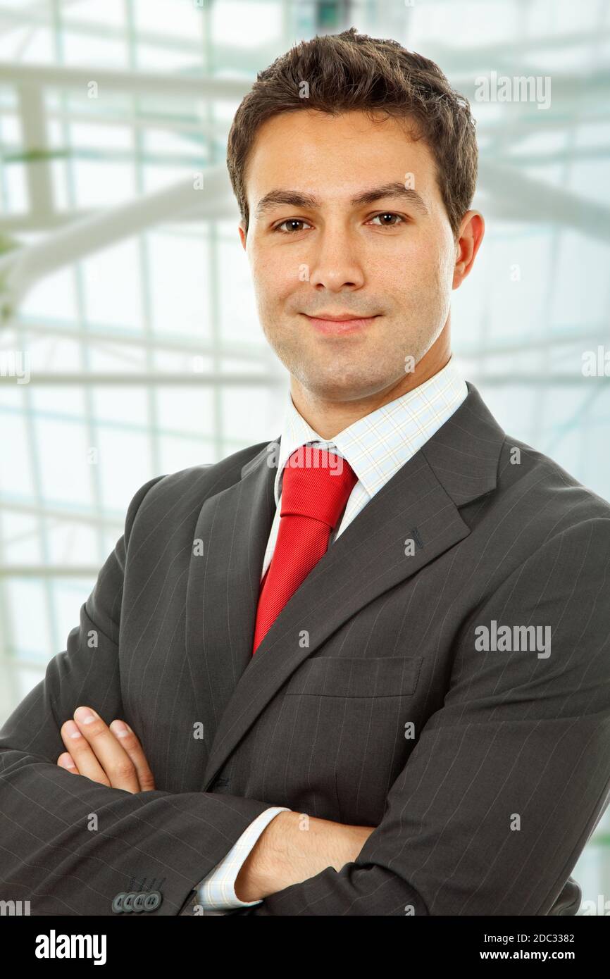 young happy businessman portrait at the office Stock Photo - Alamy