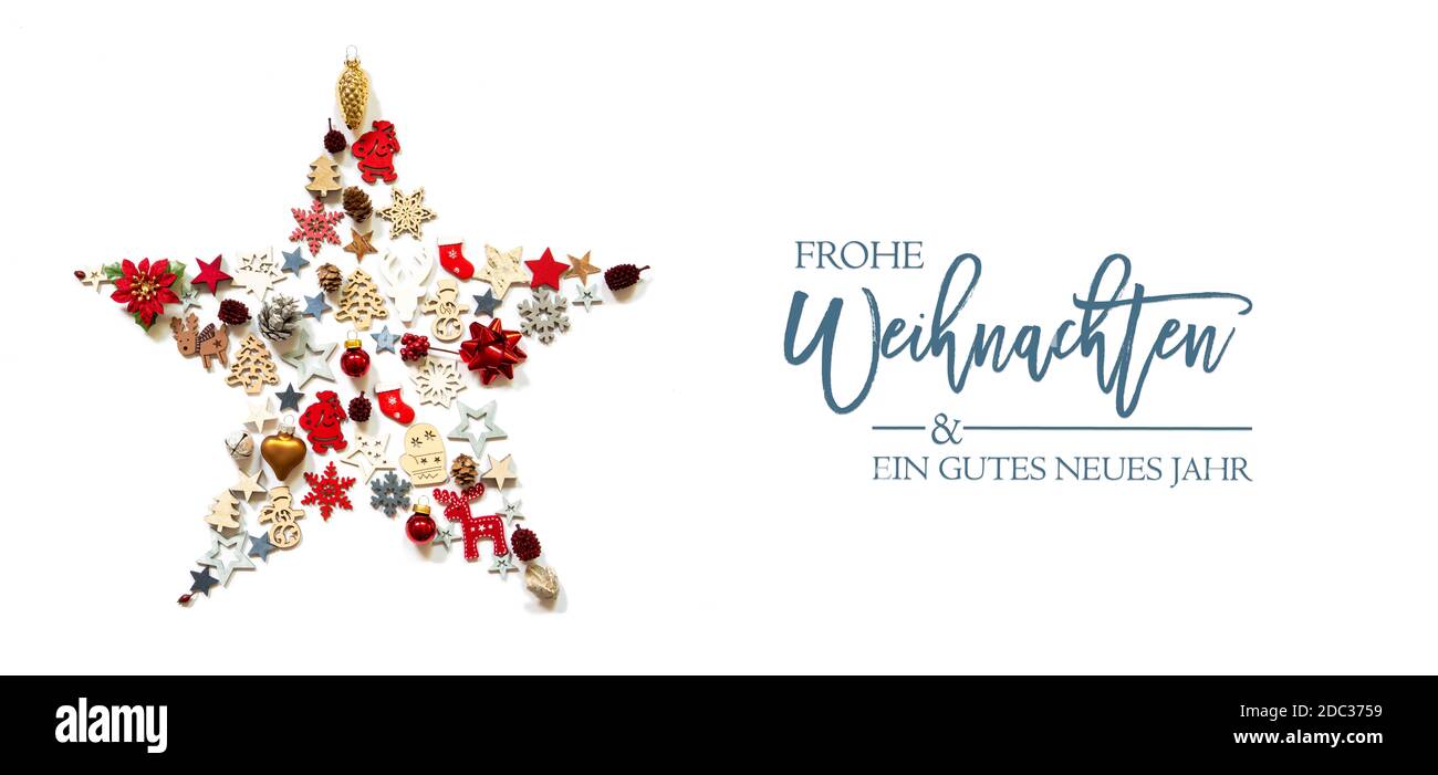 Christmas Star Build Of Vairous Christmas Decoration And Ornaments. German Text Frohe Weihnachten Und Ein Gutes Neues Jahr Means Merry Christmas And A Stock Photo