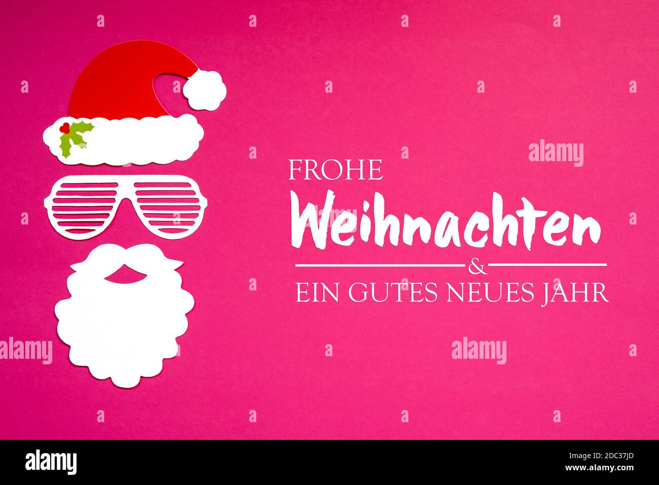 German Frohe Weihnachten Und Ein Gutes Neues Jahr Means Merry Christmas And A Happy New Year. Santa Claus Paper Mask With Christmas Decoration And Acc Stock Photo