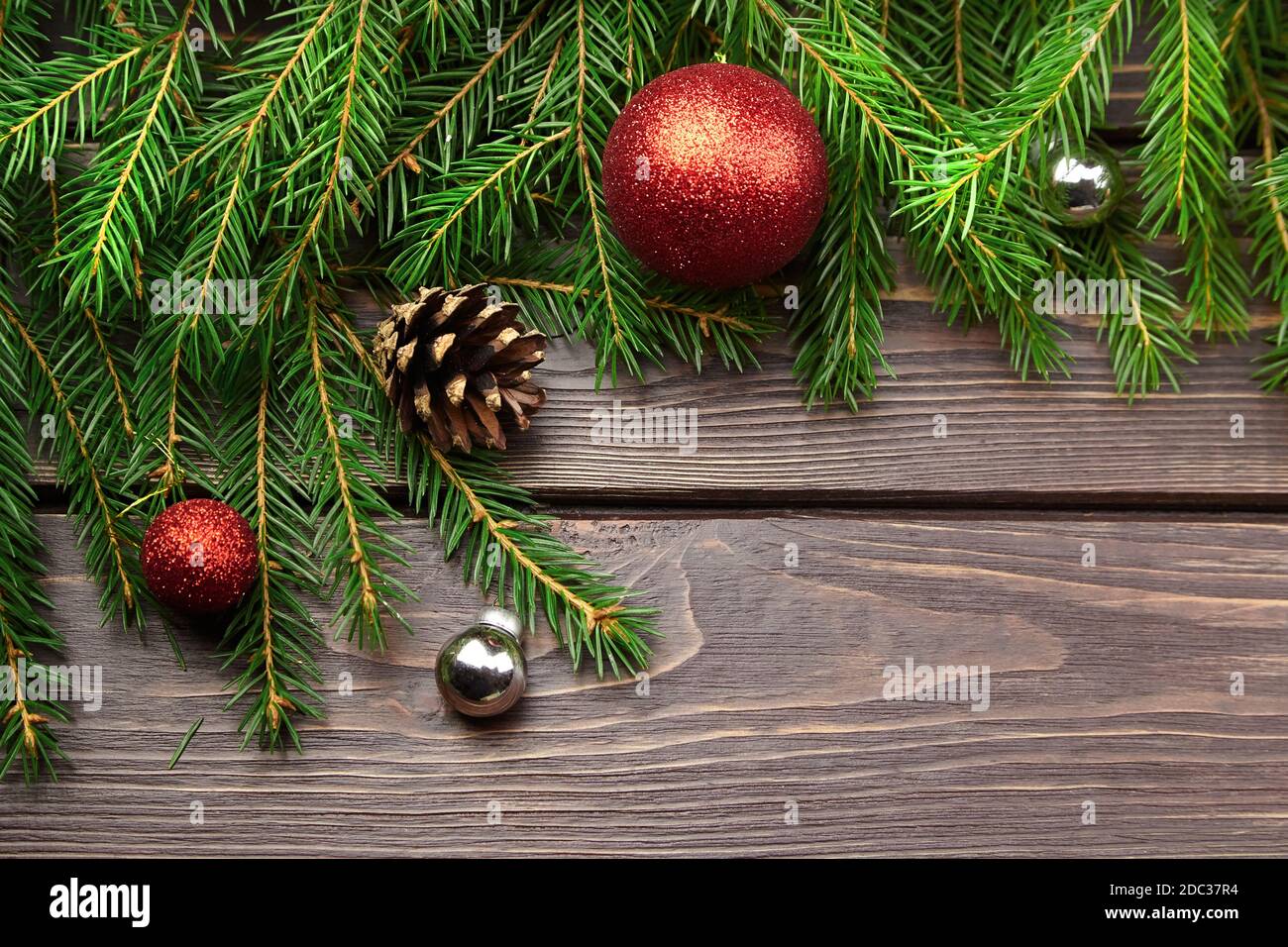 Christmas and New Year decorations with fir tree branches on dark ...