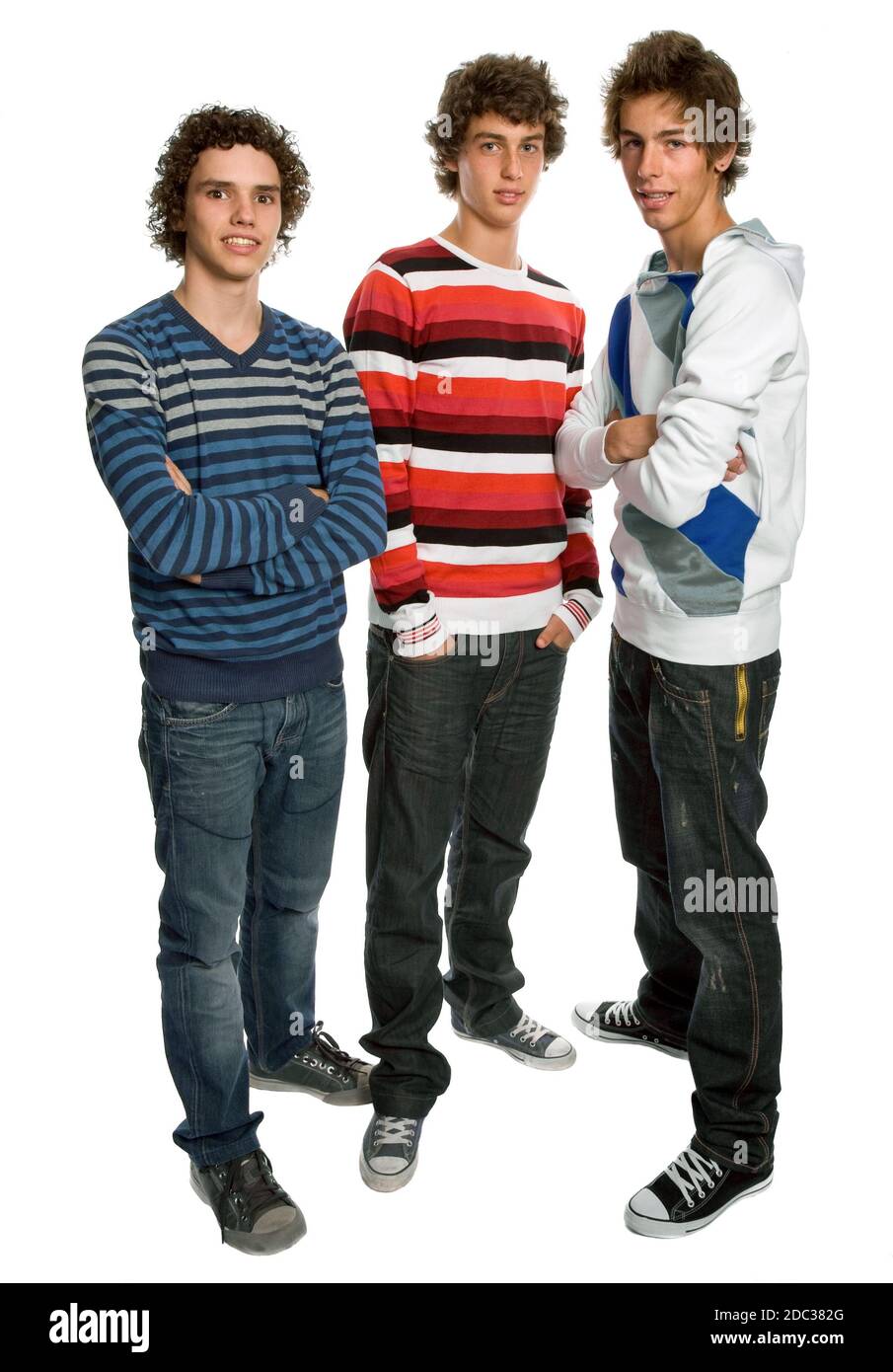 three young men standing, on a white background Stock Photo - Alamy