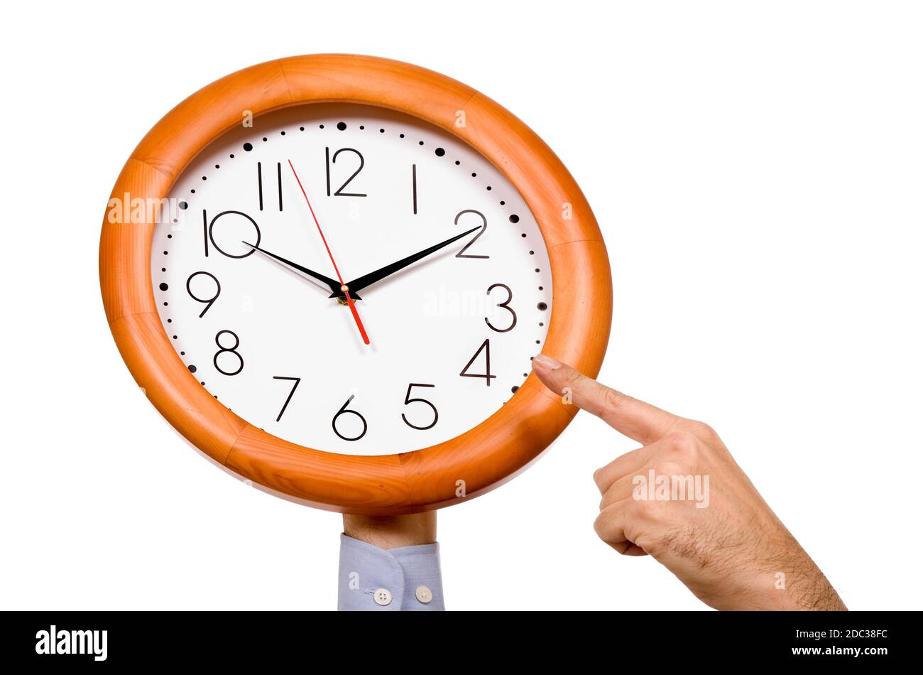 man hand pointing to a clock isolated in white background Stock Photo