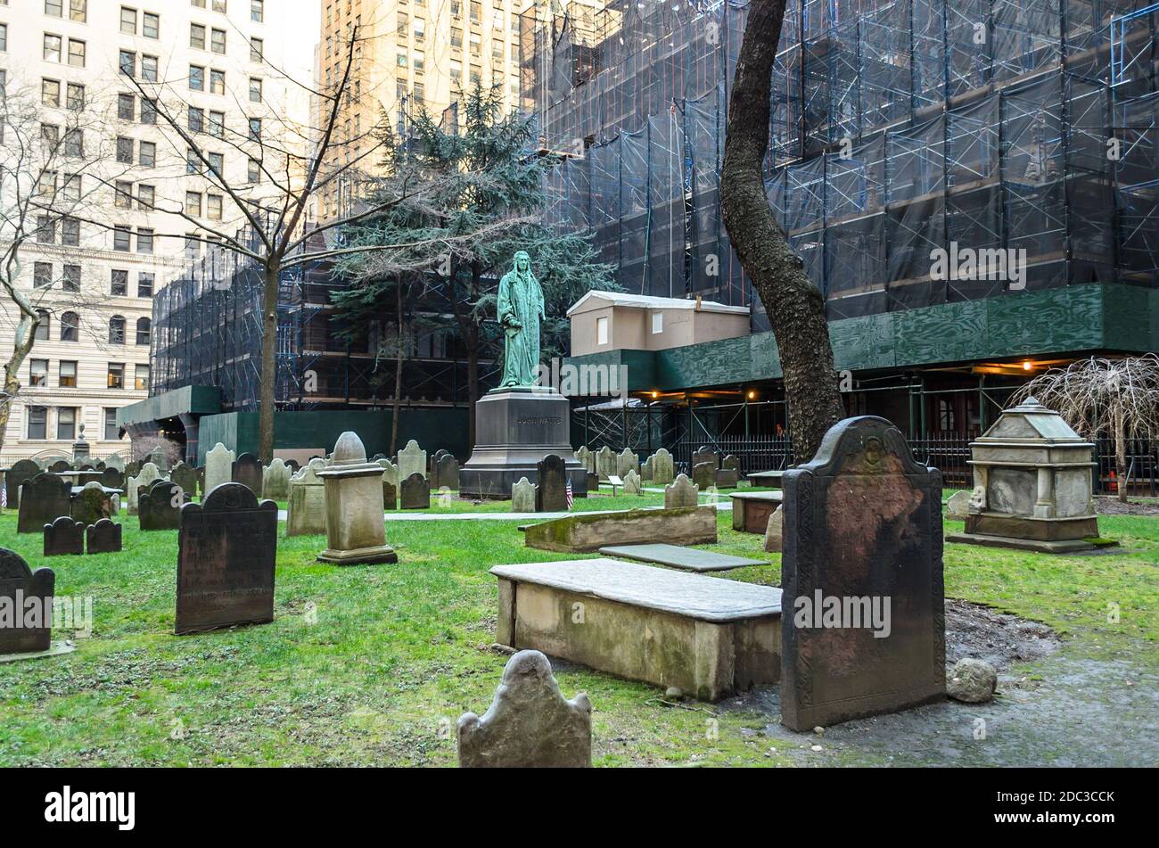 Trinity Church Cemetery in Downtown Manhattan. Aged and Old Graves and Statues in the Churchyard. New York City, NY, USA Stock Photo