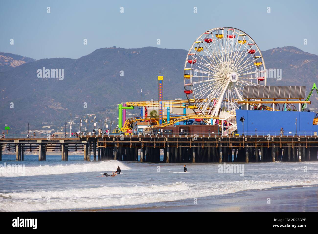 Pacific Park Roller coaster and big wheel. Santa Monica Pier and beach, Santa Monica, California, United States of America. Stock Photo